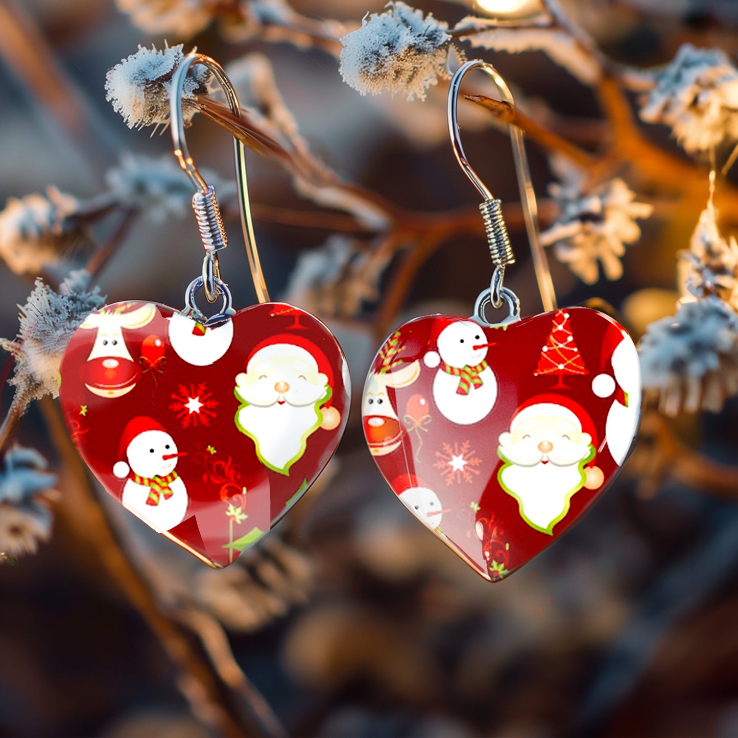 a pair of red heart shaped earrings hanging from a tree