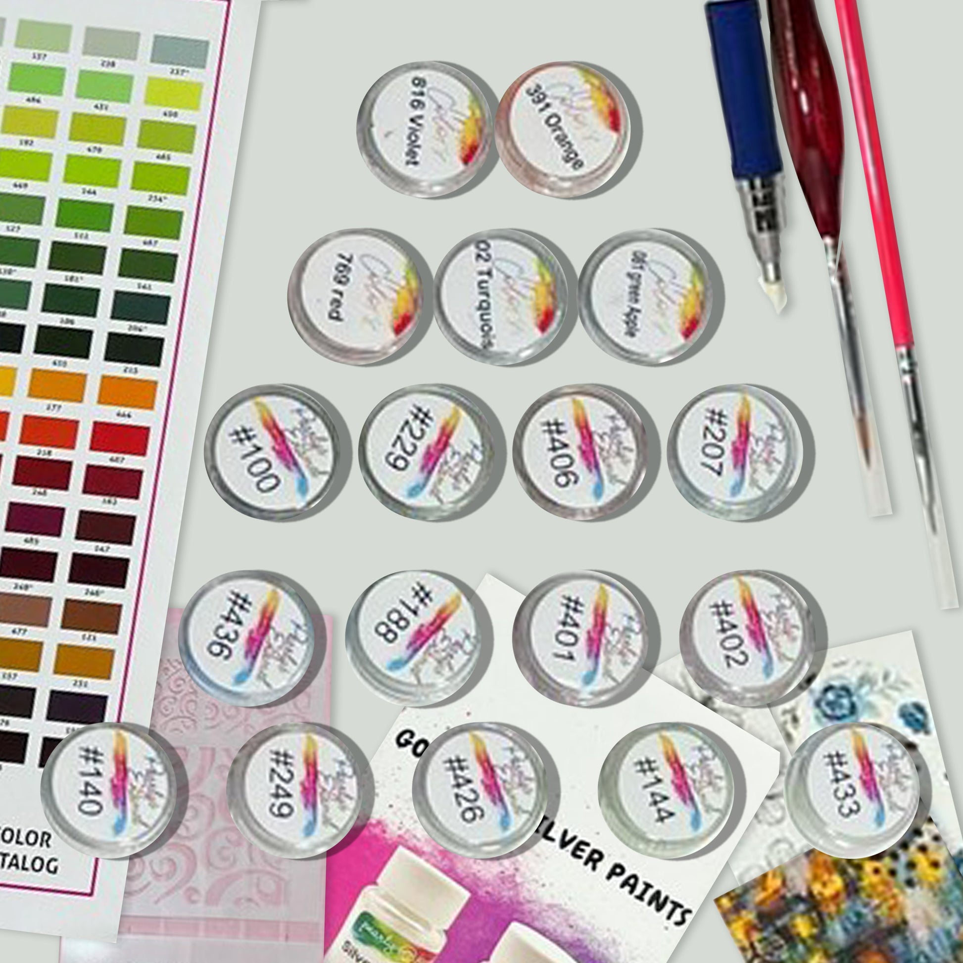 a variety of paint samples and paint brushes