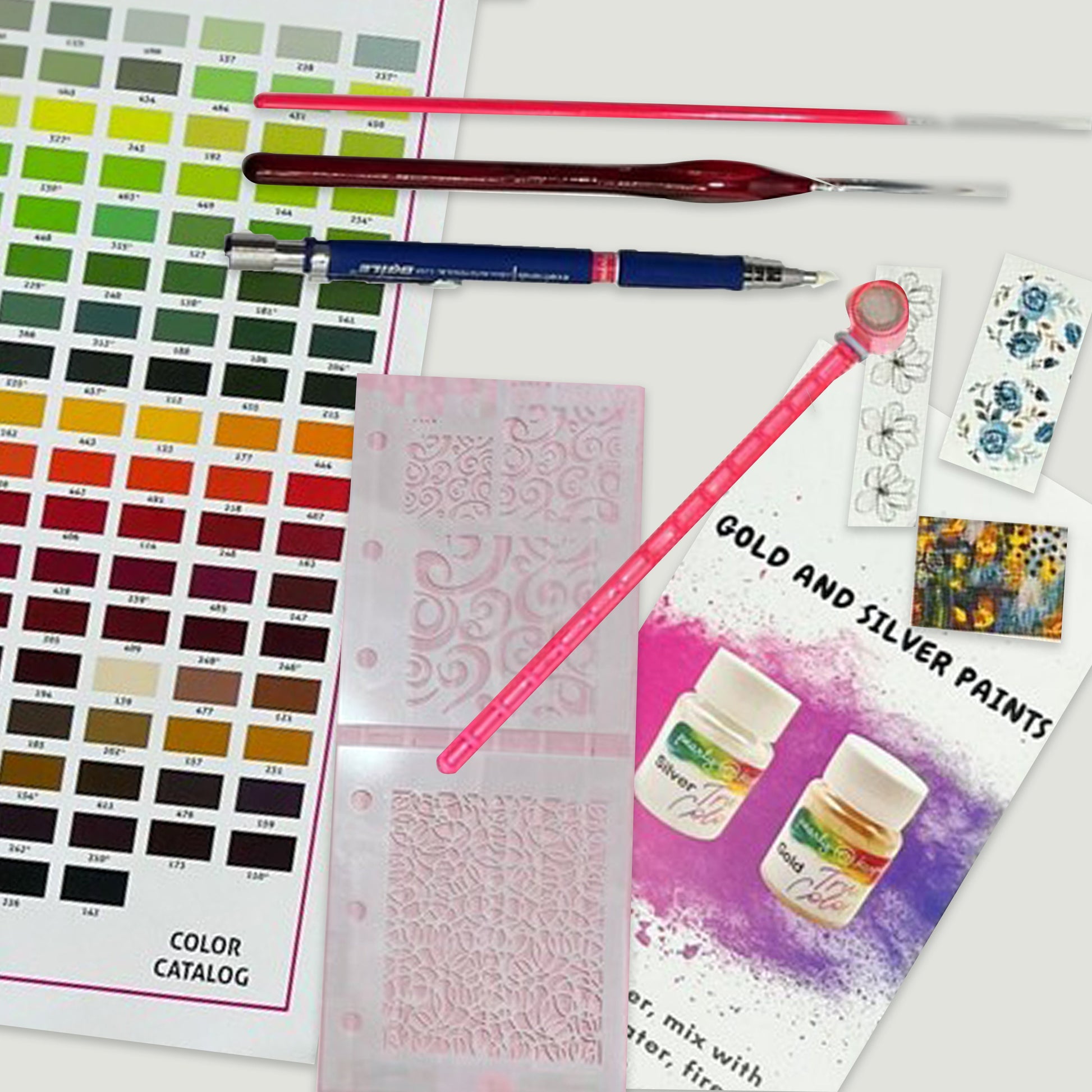 a variety of paints and a brush on a table