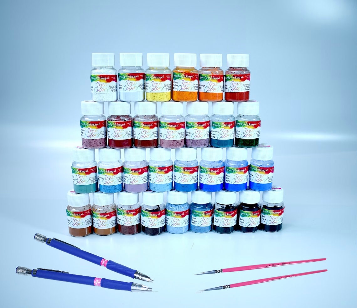 a group of paint bottles sitting next to each other
