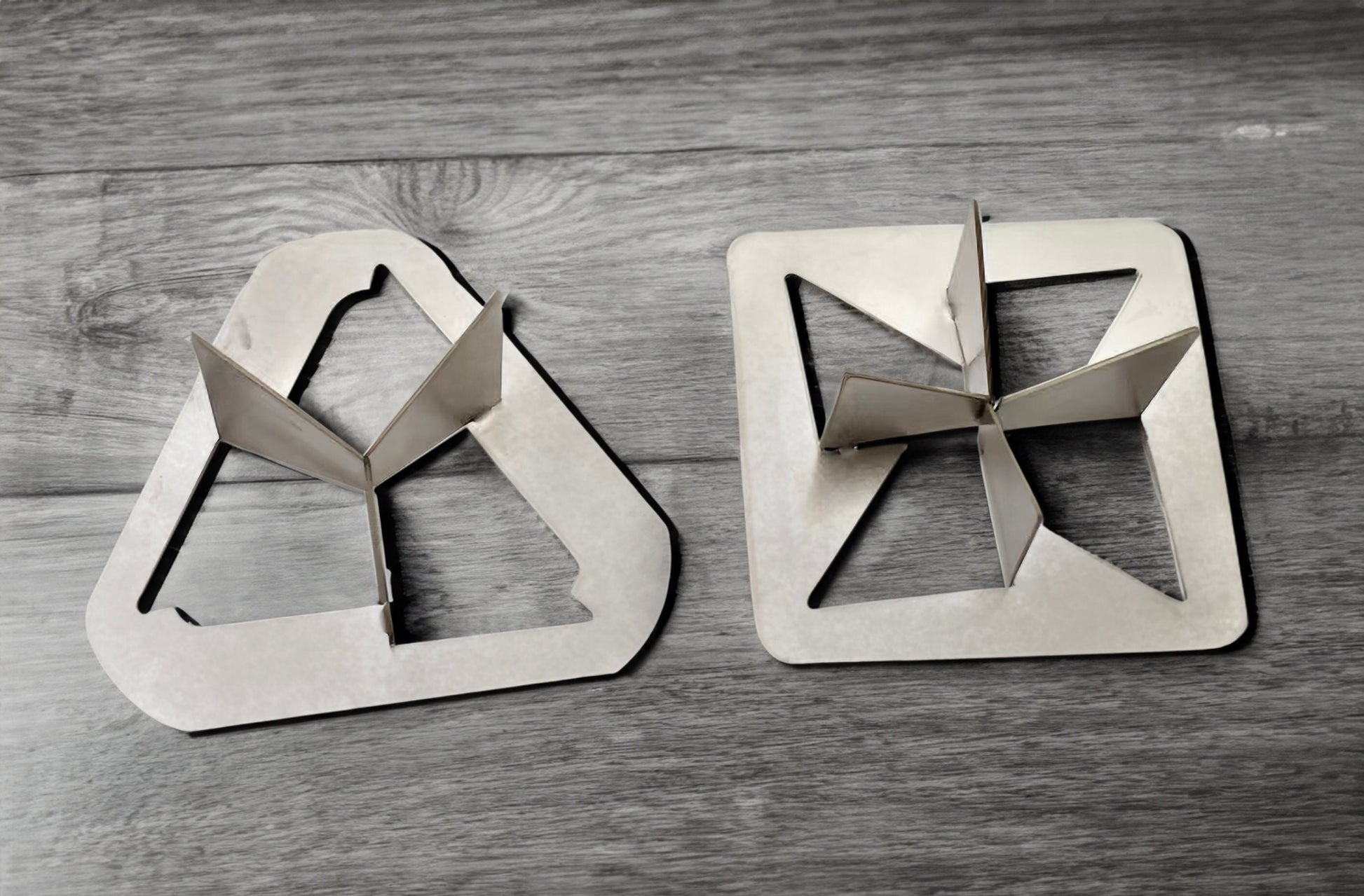 a pair of scissors sitting on top of a wooden table
