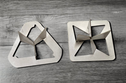a pair of scissors sitting on top of a wooden table